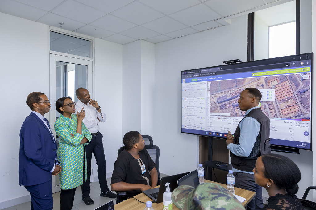 Team reviewing AI mapping data at the summit